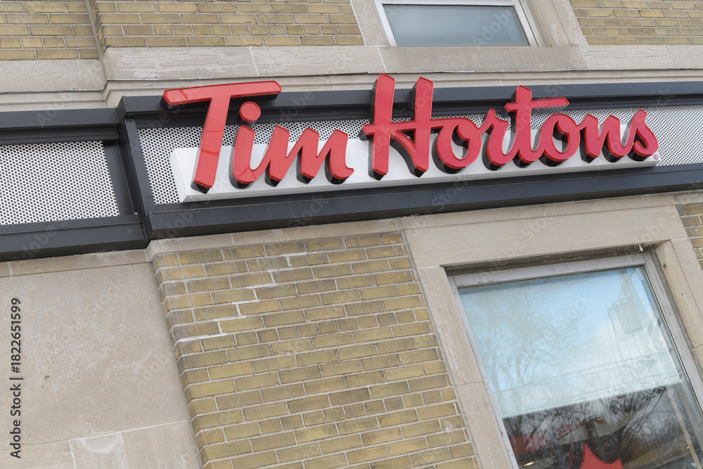 Fototapeta premium exterior building and sign of Tim Hortons, a coffee shop chain, located here at 878 Eglinton Av E, Toronto