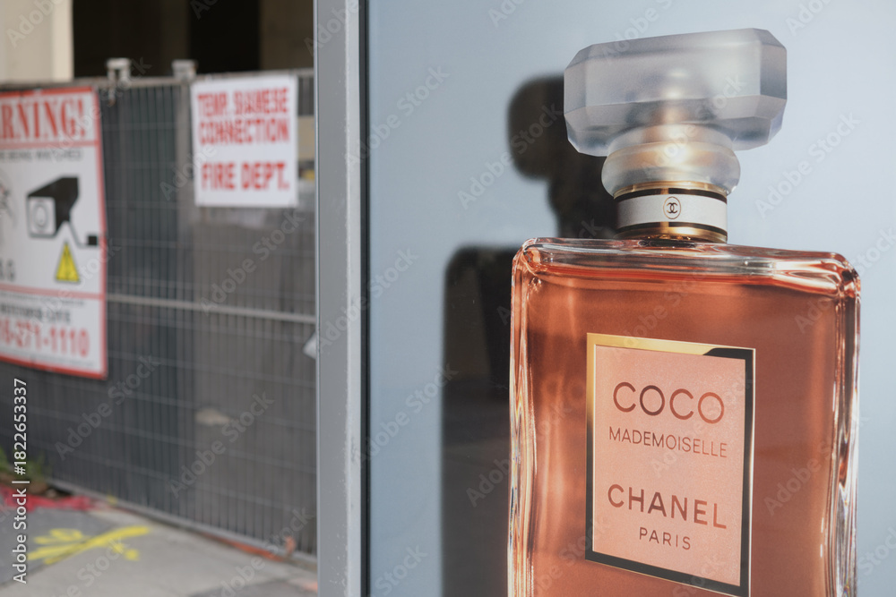 Fototapeta premium bus shelter advertising poster for CoCo perfume near a construction site on Bay St, Toronto