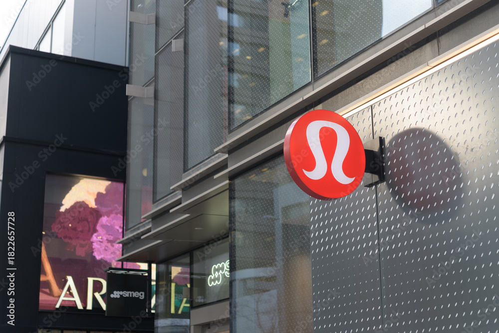 Naklejka premium projecting logo sign outside lululemon, an overpriced sportswear store, located at 2 Bloor St W, Toronto