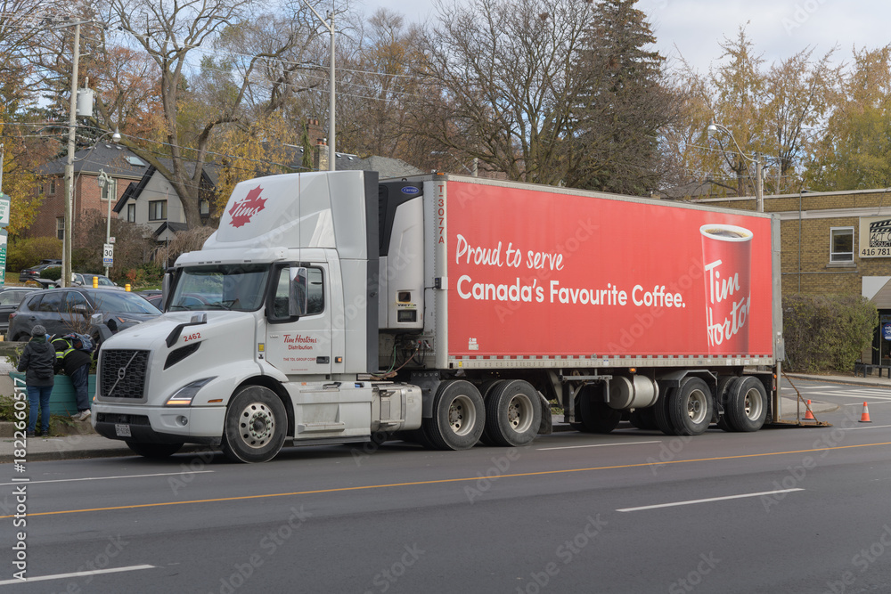 Fototapeta premium Tim Hortons delivery truck on Eglinton Av W, Toronto