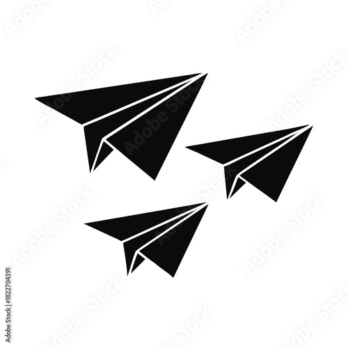 Three black silhouette paper airplanes flying together symbolizing travel communication and creative journey concepts