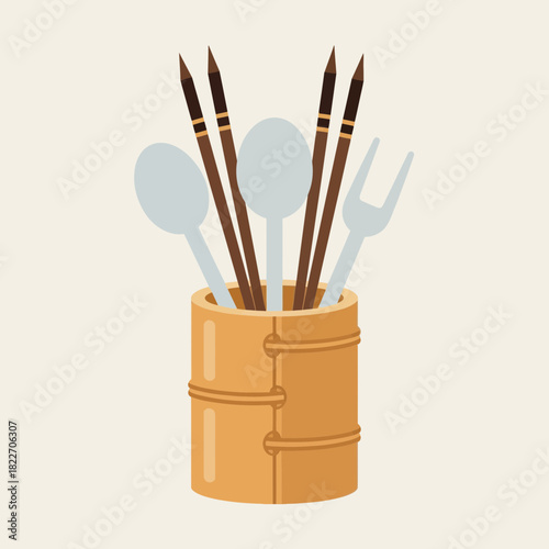 Bamboo utensil holder with an array of dining ware tools inside it