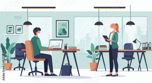 Two business people working in a modern office with social distancing measures.