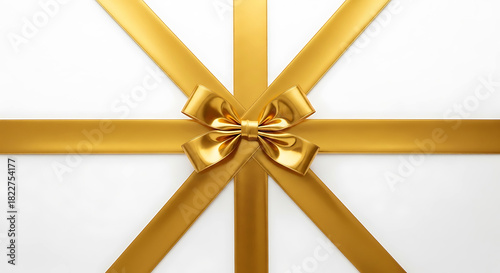 Golden ribbon bow tied on white background with crossing ribbons gift present