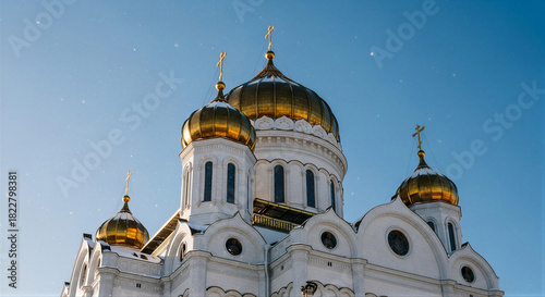 Orthodox church golden domes against blue sky for Easter or Annunciation greeting card