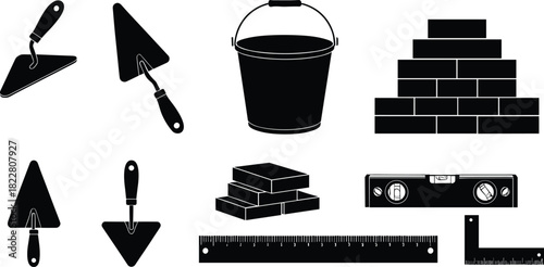 Black silhouette construction tools and materials on white background trowel bucket