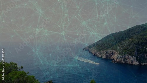 Small white boat emerging from narrow inlet, moving left, leaving widening wake toward open water