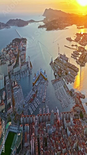  Aerial view of port city on the mediterranean coast of southern France. Aerial view of Toulon with ships and boats by the Marina Port with colourful houses. Beautiful buildings and colourful houses