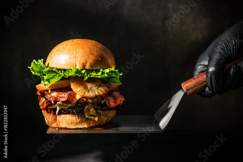 Gourmet Burger with Pineapple Bacon and Jalapeos Served on a Spatula