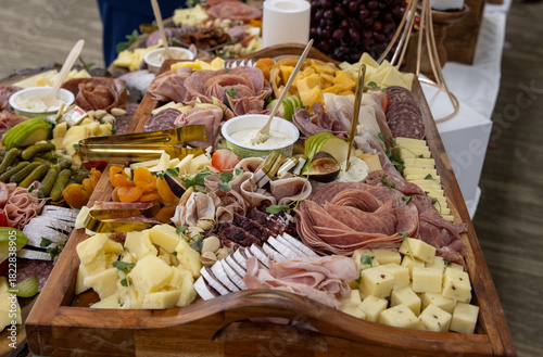 Charcuterie table displaying meats and cheeses.