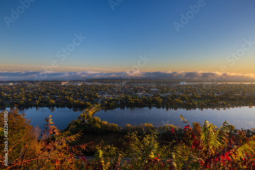 A Scenic View Of A Town Along The Mississippi River with Fog Clouds On The Horizon