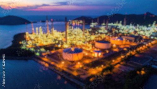 Illuminated oil refinery at dusk. Aerial view