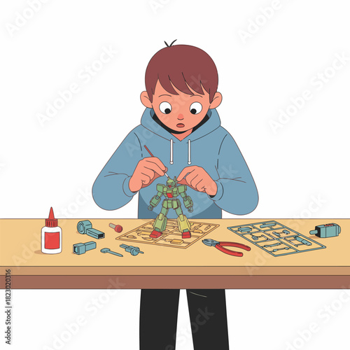 Young boy assembling a model kit with focus and concentration.