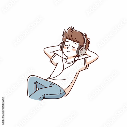 Young boy relaxing listening to music with headphones on.