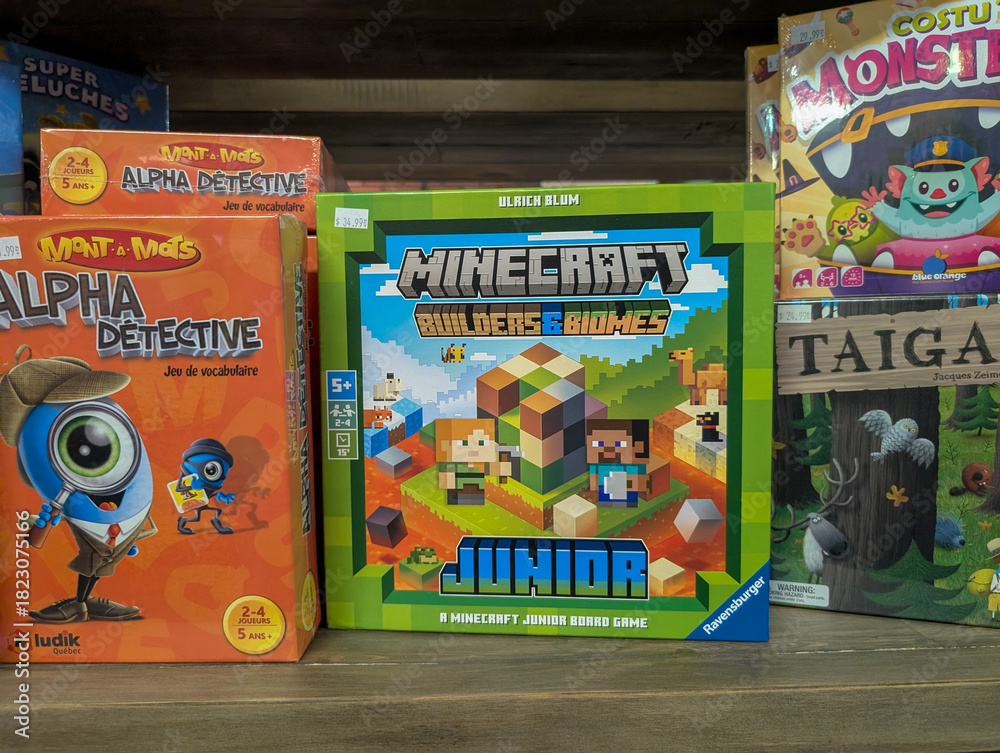 Fototapeta premium Canada, 08 November 2025 : Colorful board games on toy store shelf featuring Minecraft junior edition