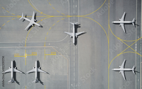 Aerial View of Parked Airplane on Airport Runway