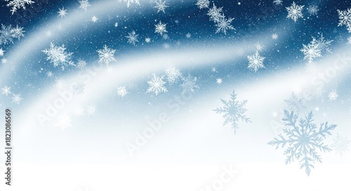 Snowflakes falling against a blue sky with white clouds.