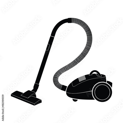 Black canister vacuum cleaner with hose and floor nozzle