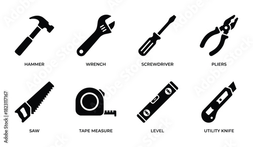 Collection of essential construction tools including hammer wrench screwdriver pliers and saw