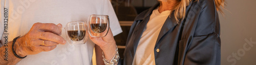 Senior couple enjoying their morning coffee together in cozy lifestyle setting