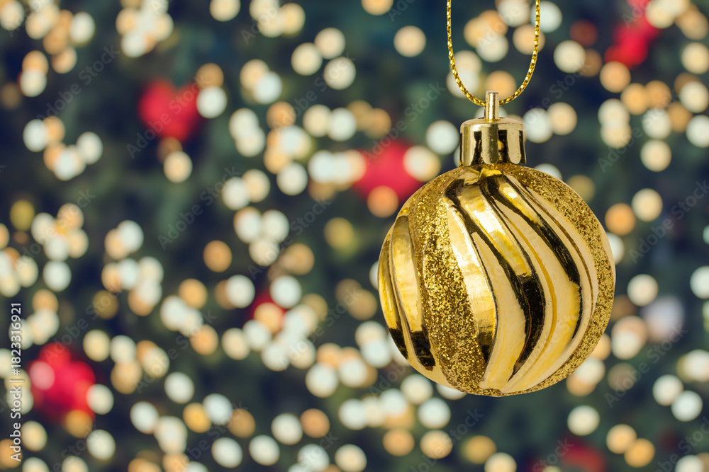Fototapeta premium Christmas ball bauble hanging decoration with bokeh light background