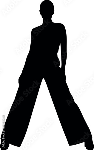 Stylish female silhouette standing confidently in a wide stance