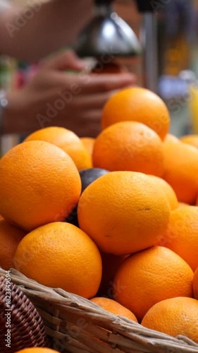 Fresh oranges piled in basket at local market