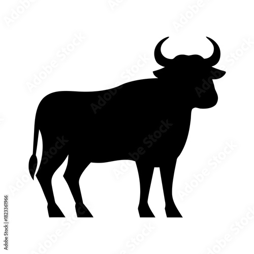 Black silhouette of a standing bull with large horns