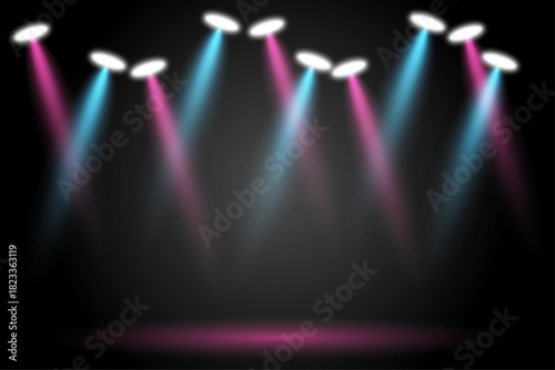 Stage lighting with blue and pink beams on dark background