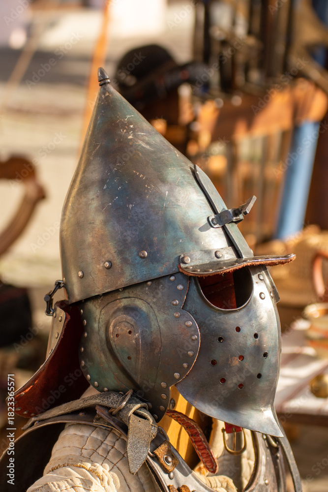 Obraz premium old medieval bascinet-type helmet popular in medieval Europe, evolving from a simple steel cap in the late 13th century