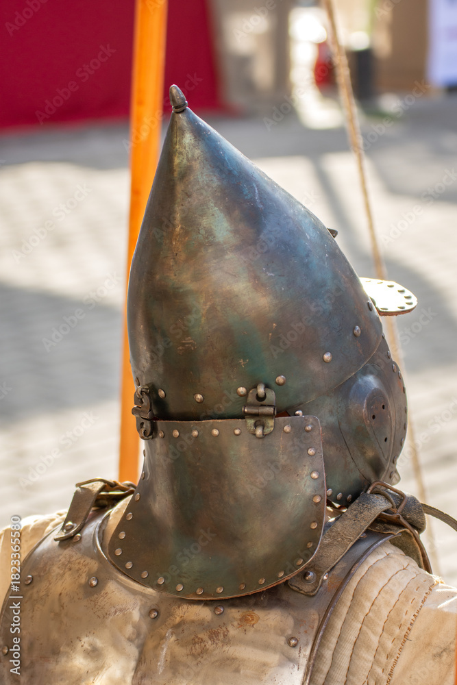 Obraz premium old medieval bascinet-type helmet popular in medieval Europe, evolving from a simple steel cap in the late 13th century