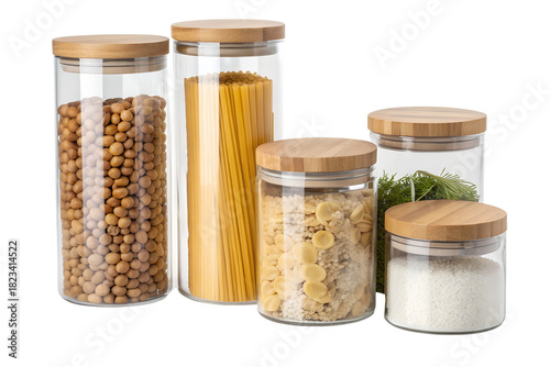 Glass storage jars with wooden lids filled with various dry food ingredients