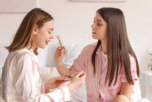 Female friends doing makeup...