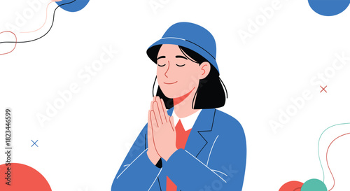 A serene young woman in a blue hat and jacket closes her eyes and clasps her hands, expressing peace, prayer, or gratitude.