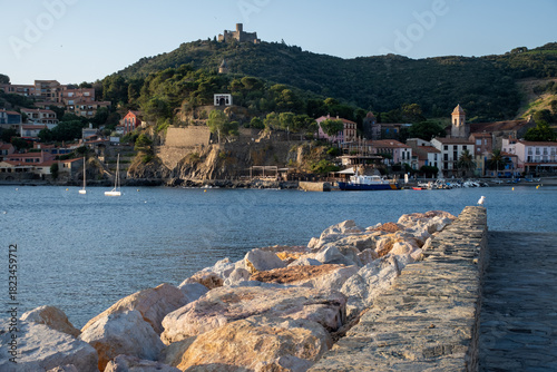 Fototapeta Naklejka Na Ścianę i Meble -  View of colourful Collioure, narrow streets and yellow, pink, orange houses, summer vacation destination town with historical buidings and beaches, Pyrenees-Orientales, France