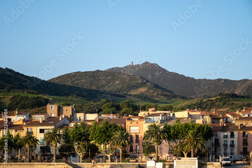Fototapeta Naklejka Na Ścianę i Meble -  View of colourful Collioure, narrow streets and yellow, pink, orange houses, summer vacation destination town with historical buidings and beaches, Pyrenees-Orientales, France