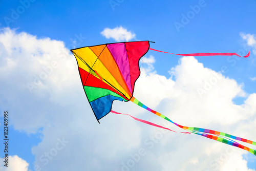 Colorful kite flying in blu...