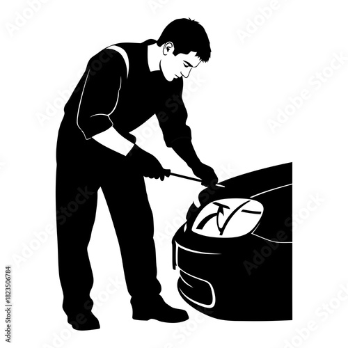 Skilled mechanic expertly repairs car headlight with precision and expertise in auto shop