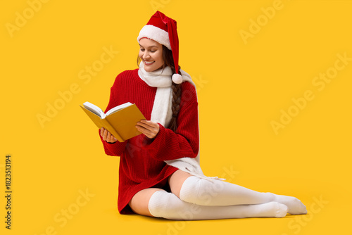 Happy young woman in Santa ...