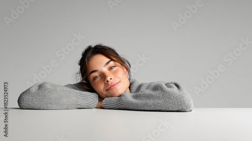 candid moment of someone leaning on a table daydreaming quietly