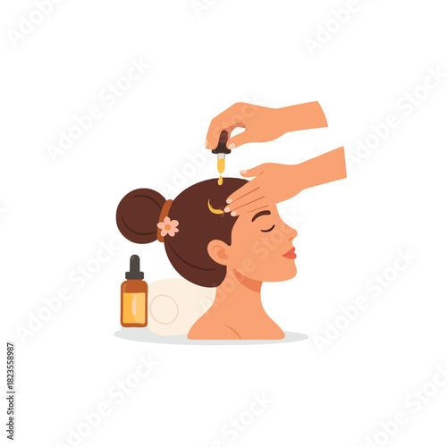Woman receiving a revitalizing hair oil treatment for healthy shiny beautiful locks in a beauty
