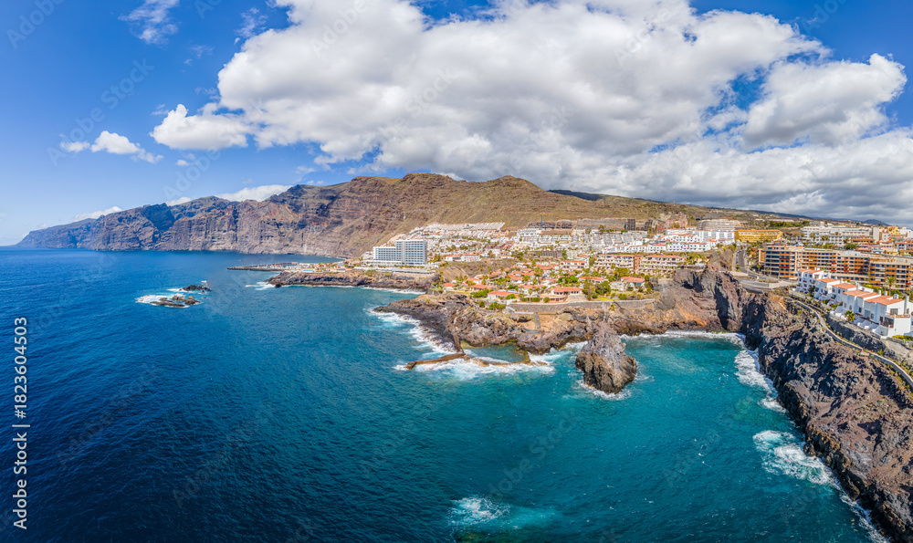 Obraz premium Aerial view with Puerto de Santiago city and Los Gigantes mountain, Atlantic Ocean coast, Tenerife, Canary island, Spain