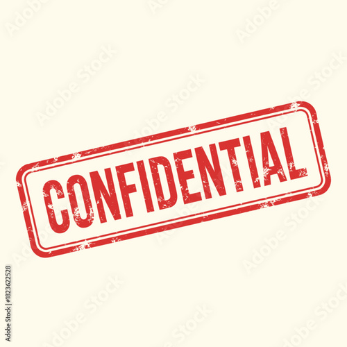 Red rectangular rubber stamp with the word 'CONFIDENTIAL' in bold capital letters, angled on a light background, indicating sensitive information.