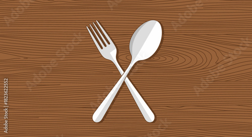 A polished silver fork and spoon are elegantly crossed over a rich, textured wooden background, symbolizing dining and culinary experiences.