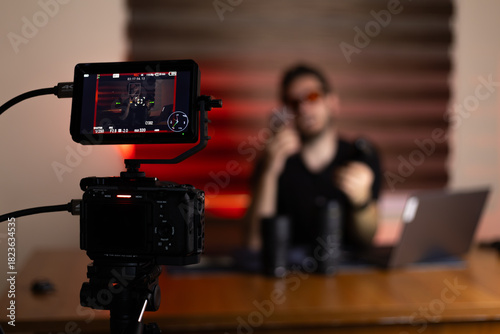 Blogger is recording a video for their blog with camera