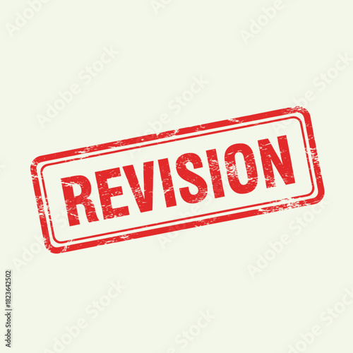 Red rectangular rubber stamp with a grunge texture, imprinting the word REVISION on a light background.