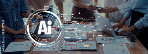 Fotografi Diverse professionals collaborate in an office setting, engaging with AI-driven data visualizations on a table filled with documents, charts, and technology