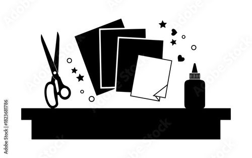 Crafting essentials - scissors, paper, and glue for creative projects.