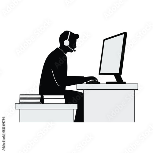 Helpdesk operator with headset working at computer