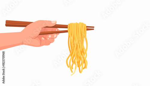 Closeup of human hand holding chopsticks eating food like pasta or sushi